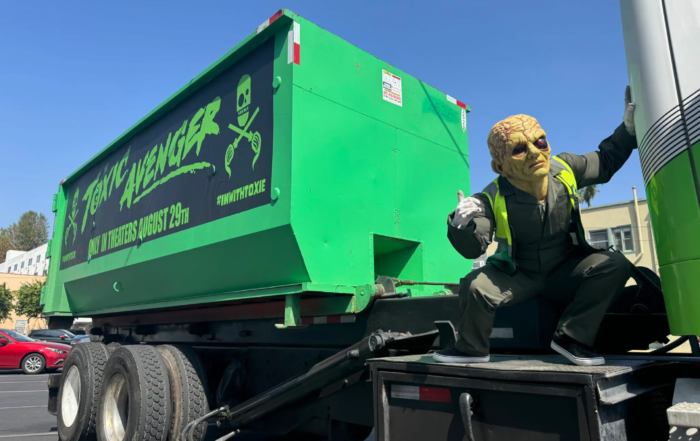 The toxic avenger cleans up los angeles on a dump truck image.